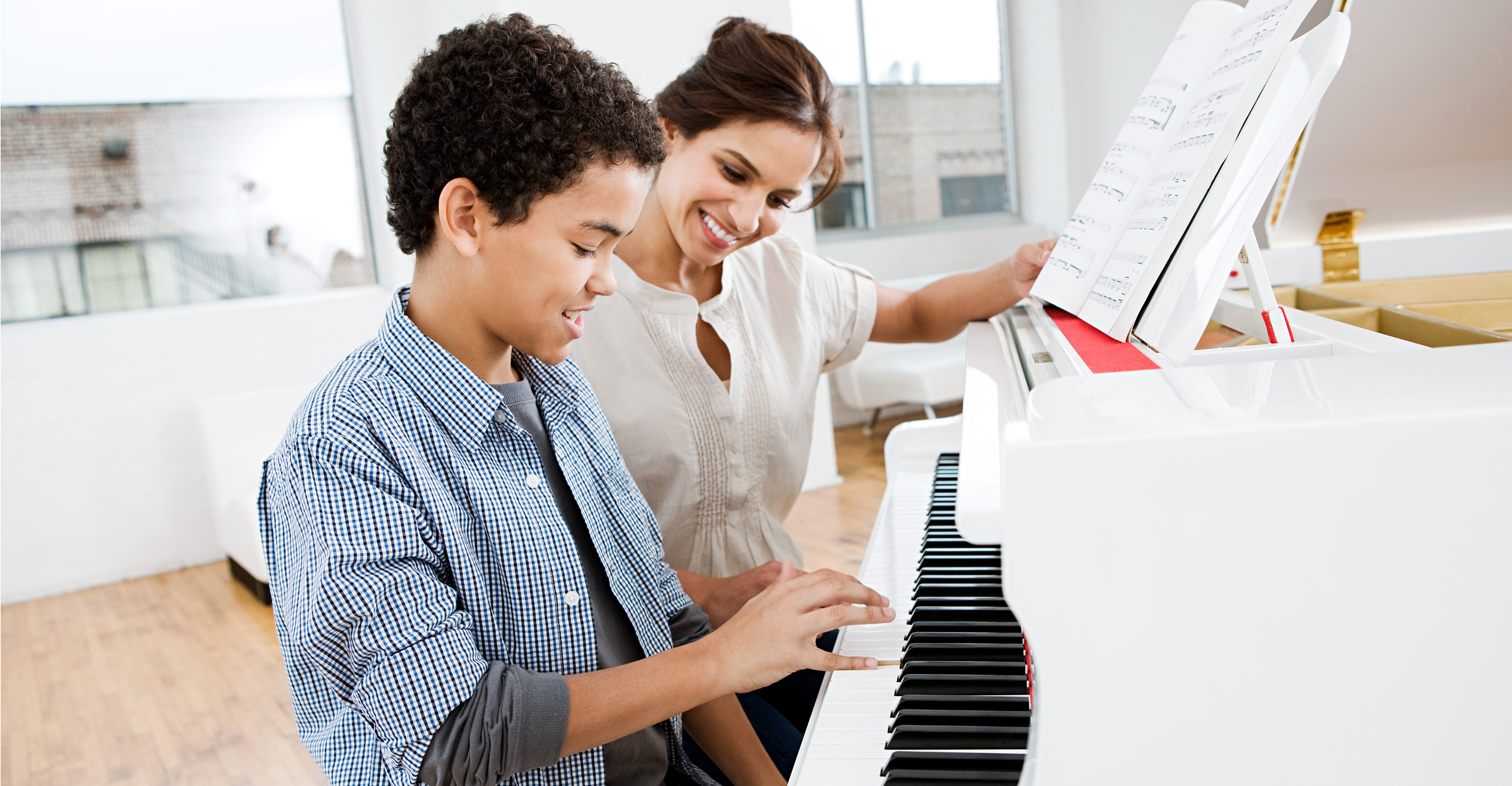 Learning piano in a bright room