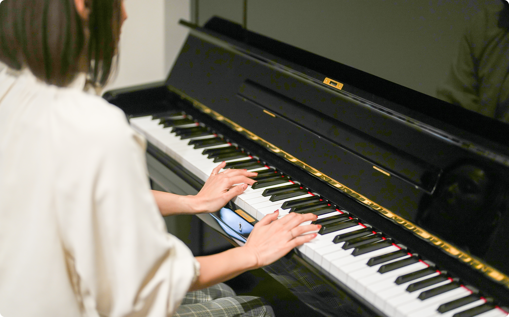 Hands on piano keys