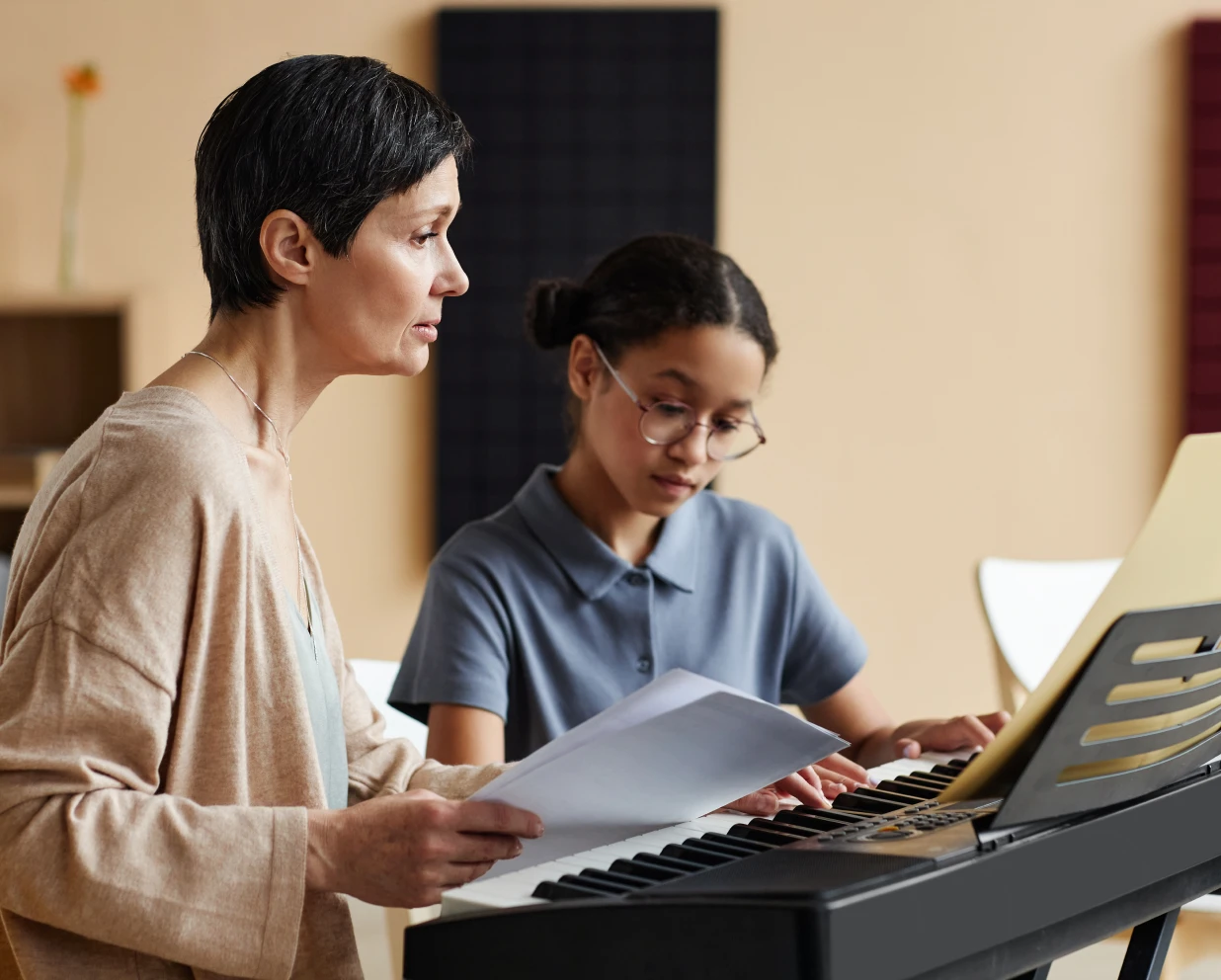 Music lesson with keyboard and sheet music